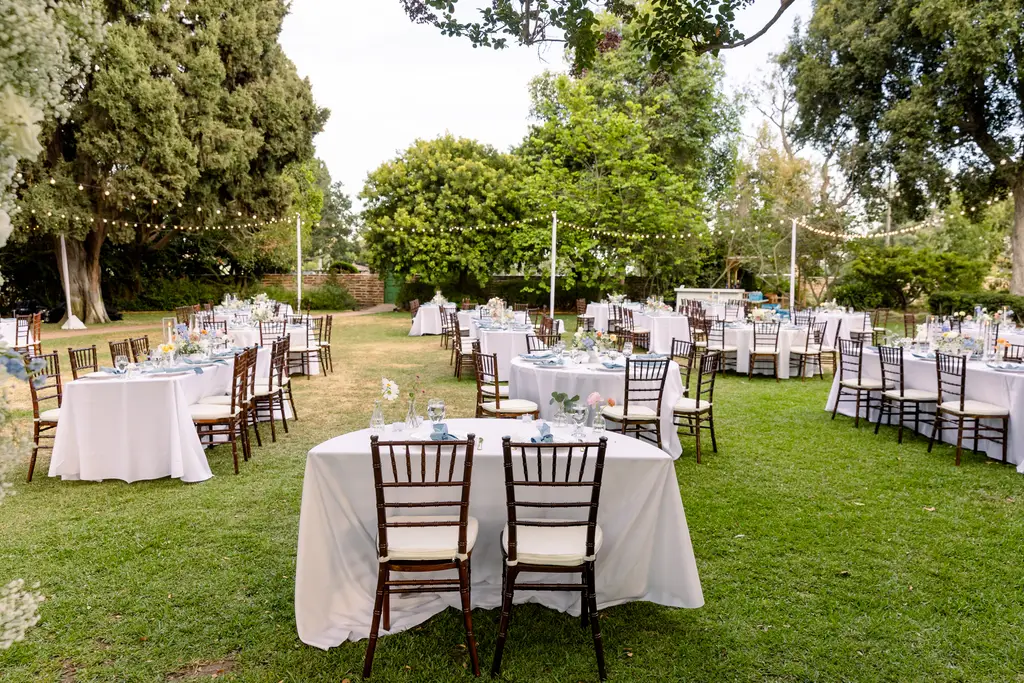 Outdoor wedding reception with tables and chairs