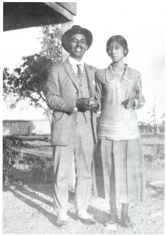 Vintage photograph of a couple standing outside.