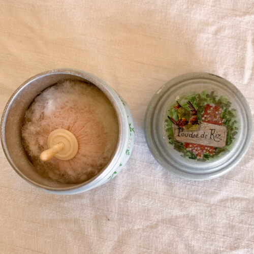 Vintage powder container with floral lid design