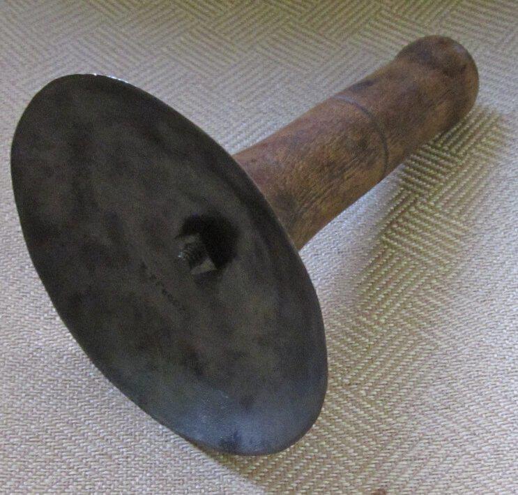 Vintage woodworking tool on textured surface.