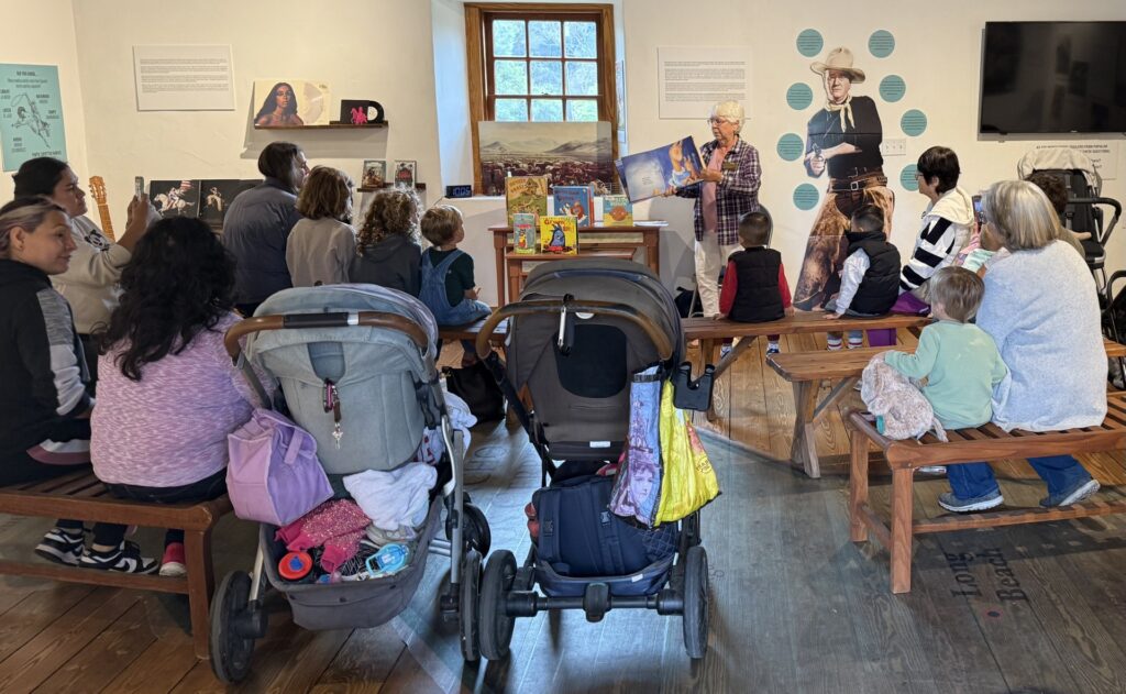 Storytime session with children and adults in library.