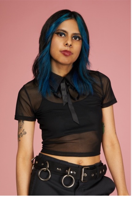 Person with blue hair and black outfit
